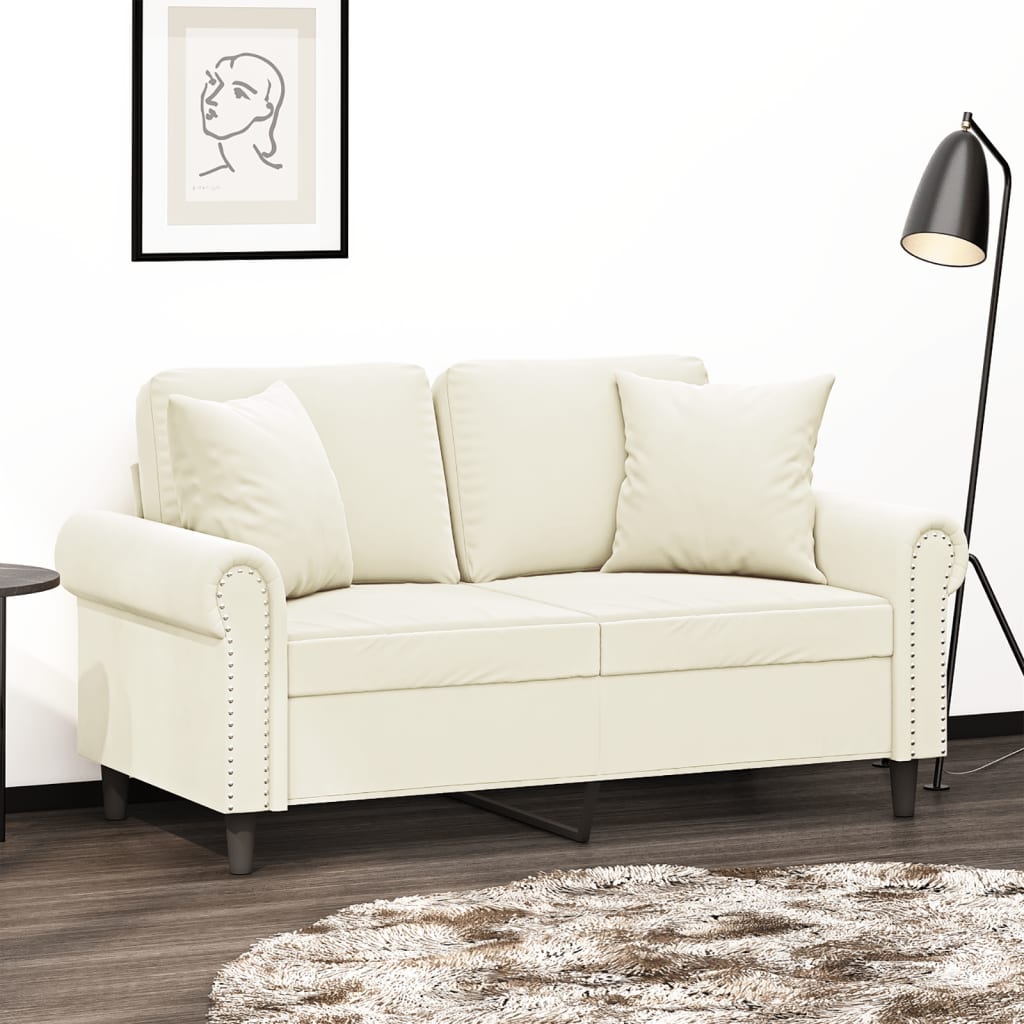 2-personers sofa med pyntepuder 120 cm velour cremefarvet